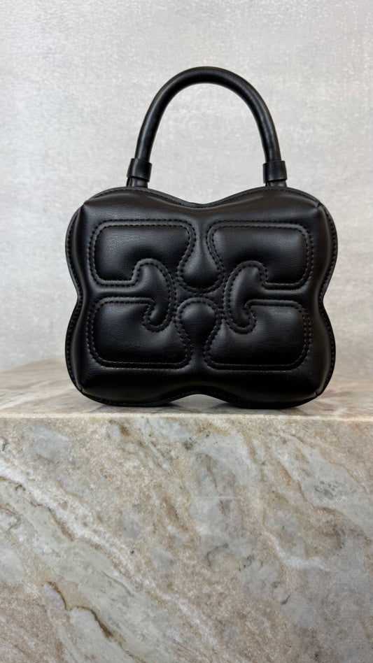 black ganni logo shaped handbag